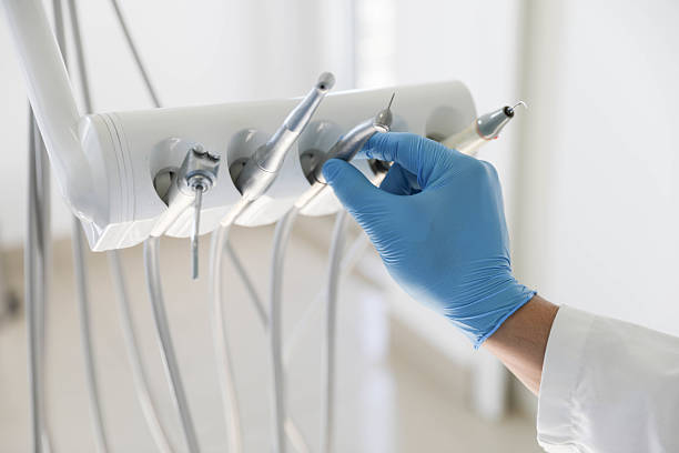 Professional Tooth Extraction technician working in Monticello, IL